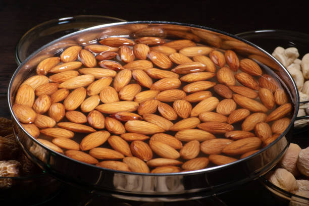 Soaked almond in water bowl, drenched almond