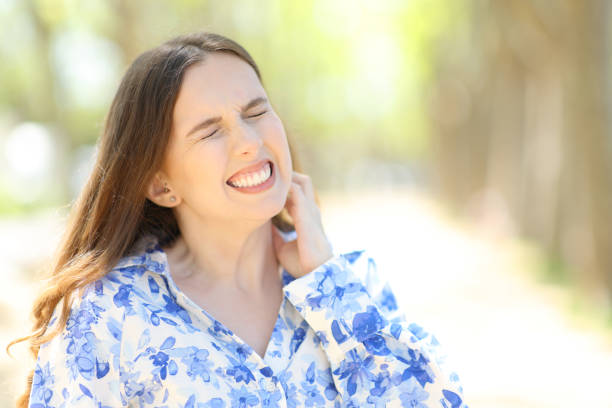 Stressed woman scratching itchy neck