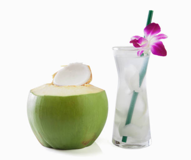 Green coconuts with drinking straw isolated