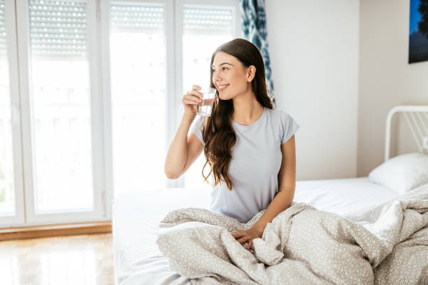 Healthy young woman taking supplements