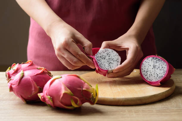 Hand peeling dragon fruit or pitaya, Tropical fruit, Healthy eating