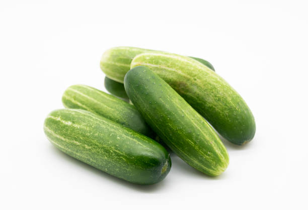 green cucumber over on white background.