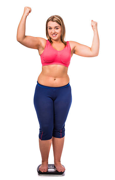 Fat woman diet measures the weight isolated on a white background
