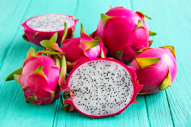 White Dragon Fruit on an old turquoise wooden table.