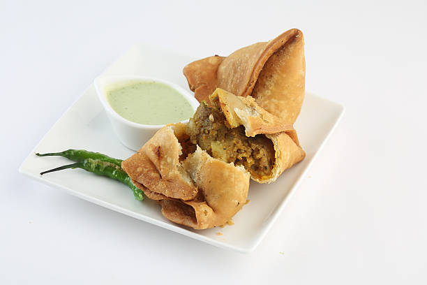 keema samosa with fresh mint dipping sauce , indian food