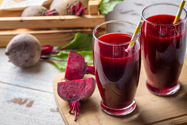 Glass of fresh beetroot juice or beetroot smoothie with vegetables